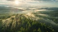 A beautiful sunrise over a forest with mist Royalty Free Stock Photo