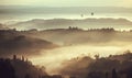 Beautiful sunrise over hills in Tuscany with garden trees, mansions, green hills. Fog in Italian countryside Royalty Free Stock Photo