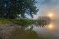 Beautiful sunrise over misty lake. Royalty Free Stock Photo