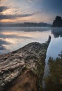 Beautiful sunrise over misty lake.