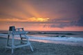 Beautiful sunrise over Myrtle beach with a lifeguard chair on the shore in South Carolina Royalty Free Stock Photo