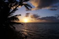 Beautiful Sunrise over the ocean with waves moving to rocky Beach on the Molokai Royalty Free Stock Photo