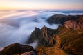 Beautiful sunrise over the sea of clouds. View of the rocks and peaks of Madeira Island, Portugal Royalty Free Stock Photo