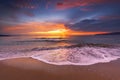 tropical beach and sunrise over the sea shore with splashed waves in the sand, ocean sunset landscape Royalty Free Stock Photo