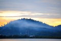 Beautiful sunrise over sea with fog on mountain Royalty Free Stock Photo