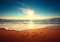 Beautiful cloudscape over the sea, sunrise shot. Happy New Year 2021 written on seashore Royalty Free Stock Photo