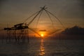 Beautiful sunrise at Pakpra canal, Phatthalung, Thailand. Fisherman with giant square dipnet at Pakpra. Scenic view of Pakpra