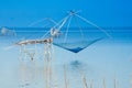 Beautiful sunrise at Pakpra canal, Phatthalung, Thailand. Fisherman with giant square dipnet at Pakpra. Scenic view of Pakpra