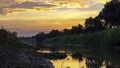 Beautiful sunrise reflection in a canal Royalty Free Stock Photo