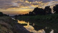 Beautiful sunrise reflection in a canal Royalty Free Stock Photo