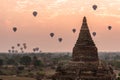 Beautiful sunrise scene of Ancient Pagoda with hot air balloon