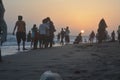 Beautiful sunrise scene at beach with people