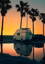 Beautiful sunrise scene with white small camping van