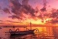 Beautiful sunrise scenery with Jukung is traditional balinese fishing boats at Karang Beach, Sanur, Bali, Indonesia Royalty Free Stock Photo