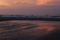 Beautiful sunrise sea beach with dramatic clouds and sky Royalty Free Stock Photo