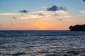 Beautiful sunrise at sea. Last minutes before dawn on the Atlantic ocean. The sun beyond horizon. Palm trees against the Royalty Free Stock Photo