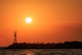 A beautiful sunrise sky behind a lighthouse.Skala Potamias, Thassos, Greece Royalty Free Stock Photo