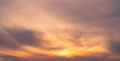 Beautiful sunrise sky. Orange, grey, and white sky. Colorful sunrise. Art picture of sky at sunrise. Sunrise and clouds