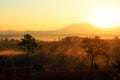 Beautiful sunrise or sunset with silhouette of tree and mountain view background at Thung Salaeng Luang National Park, Phetchabun