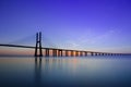 Beautiful sunrise at Vasco da Gama Bridge, the longest bridge in Europe, who spans the Tagus River in Lisbon, Portugal Royalty Free Stock Photo