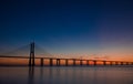 Beautiful sunrise at Vasco da Gama Bridge, the longest bridge in Europe, who spans the Tagus River in Lisbon, Portugal Royalty Free Stock Photo