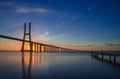 Beautiful sunrise at Vasco da Gama Bridge, the longest bridge in Europe, who spans the Tagus River in Lisbon, Portugal Royalty Free Stock Photo