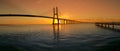 Beautiful sunrise at Vasco da Gama Bridge, the longest bridge in Europe, who spans the Tagus River in Lisbon, Portugal Royalty Free Stock Photo