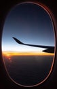 Beautiful sunrise view from airplane window. Morning colorful sky with sun light. Jet in the sky at awesome sunrise. New day. Royalty Free Stock Photo