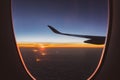 Beautiful sunrise view from airplane window. Morning colorful sky with sun light. Jet in the sky at awesome sunrise. New day. Royalty Free Stock Photo