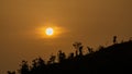 Beautiful sunrise view. Clouds on one side and the sun rising over the mountains on the other. Hilly region of Bangladesh. Photo