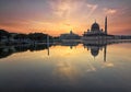 Beautiful sunrise view over Putrajaya with Putra Mosque and Putra Perdana Building as background with soft focus reflection effect Royalty Free Stock Photo