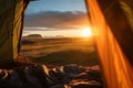 Beautiful sunrise view from the tent. Tourist admiring scenic morning landscape from inside the tent at campsite. Breathtaking