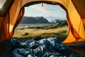 Beautiful sunrise view from the tent. Tourist admiring scenic morning landscape from inside the tent at campsite. Breathtaking