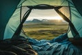 Beautiful sunrise view from the tent. Tourist admiring scenic morning landscape from inside the tent at campsite. Breathtaking