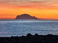 Beautiful sunrise withe the Panarea island seen from the Salina island in the Aeolian islands, Sicily, Italy Royalty Free Stock Photo