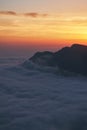 Beautiful sunset above the clouds in the mountains Royalty Free Stock Photo