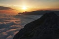 Beautiful sunset above the clouds in the mountains Royalty Free Stock Photo