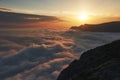 Beautiful sunset above the clouds in the mountains Royalty Free Stock Photo