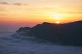 Beautiful sunset above the clouds in the mountains Royalty Free Stock Photo