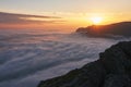 Beautiful sunset above the clouds in the mountains Royalty Free Stock Photo