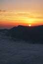 Beautiful sunset above the clouds in the mountains Royalty Free Stock Photo