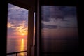 Beautiful sunset above the sea or the ocean, tropical resort. View from the hotel window Royalty Free Stock Photo