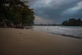 Beautiful sunset above sea or ocean with wave surf on the sandy beach in the evening, vacation and journey time tropica Royalty Free Stock Photo