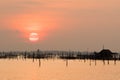 Beautiful sunset above the sea in Thailand. Silhouette of fish farms at sunset Royalty Free Stock Photo