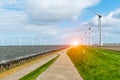 Sunset above windmills in the ocean Royalty Free Stock Photo