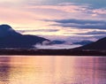 Beautiful Sunset In Alaska. Gold-Purple Reflection In The Water