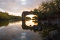 Sunset through the ruined bridge of Trois-Bassins in Reunion Island