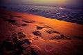 A beautiful sunset at the Baltic sea beach. Sandy beach with a bare human footprint.