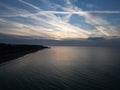 Beautiful sunset in the Baltic sea with cirrostratus clouds and the sunlight reflecting in the water Royalty Free Stock Photo