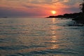 Beautiful sunset on the beach with the sea. Waves on the sea. Greece - Corfu island (Kerkyra) Agios Georgios. Royalty Free Stock Photo